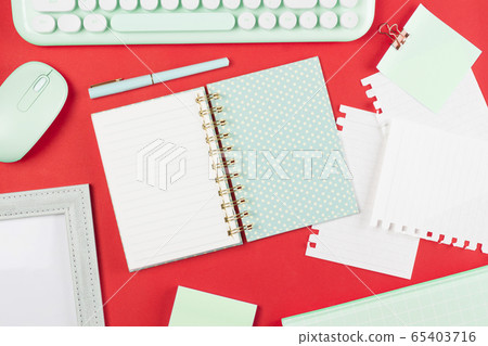 flat lay stationery on work desk in red pastel background flat lay stationery on work desk in red pastel background 65403716