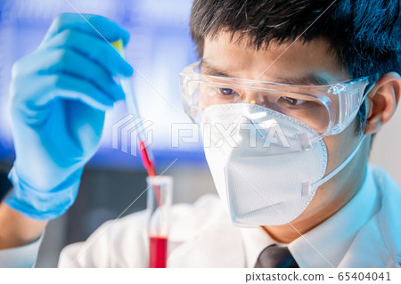 medical worker take test tube 65404041
