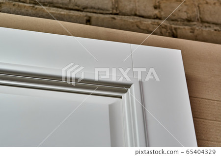 Joinery. White doors . Wood door manufacturing process. Furniture manufacture. 65404329