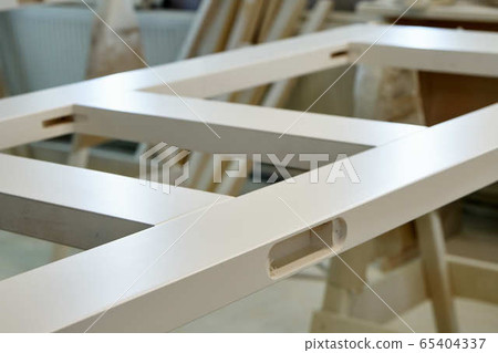 Joinery. Painted door leafs in paint spray booth. Wood door manufacturing process. 65404337