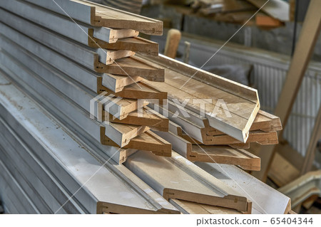 Joinery. Stacked door architraves. Wood door manufacturing process. Furniture manufacture. 65404344