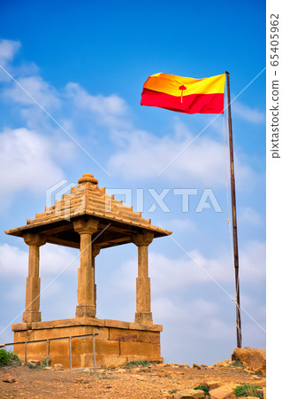 Jaisalmer flag near Bada Bagh cenotaphs Hindu tomb mausoleum . Jaisalmer, Rajasthan, India 65405962