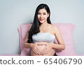 Pregnant women on the bed 65406790