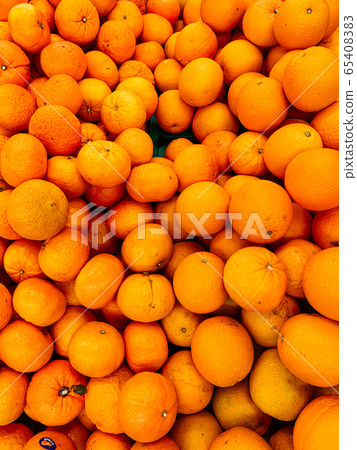 lots of ripe citrus yellow tangerines for eating like a background lots of ripe citrus yellow tangerines for eating like a background 65408383