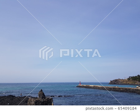 Jeju island coast road blue sky and sea Jeju island coast road blue sky and sea 65409184