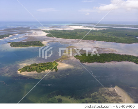 Uninhabited Tropical Islands in Indian Ocean. Aerial view of Pemba Island, Zanzibar. Tanzania. Africa Uninhabited Tropical Islands in Indian Ocean. Aerial view of Pemba Island, Zanzibar. Tanzania. Africa 65409400