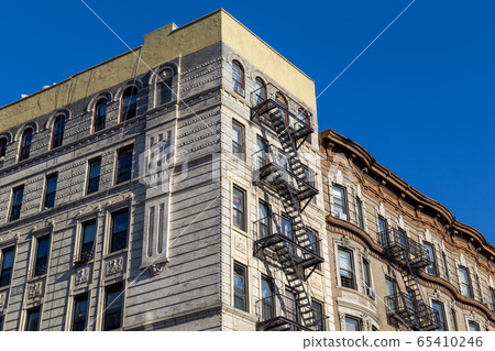 Buildings with Fire Escape in Manhattan, NYC 65410246