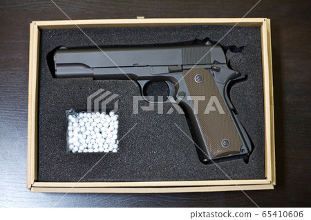 Strikeball pistol with bb bullets in a cardboard 65410606