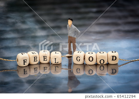 Miniature model of man and wooden cubes with feel 65412294