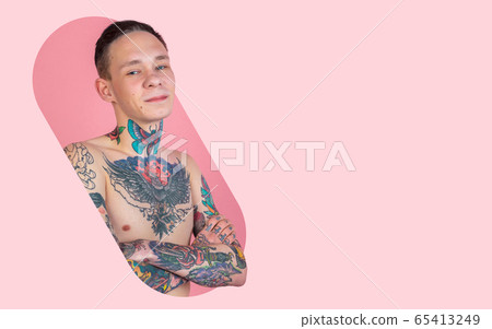 Portrait of young man with freaky appearance on bright bicolor background with geometric style, modern design, artwork Portrait of young man with freaky appearance on bright bicolor background with geometric style, modern design, artwork 65413249