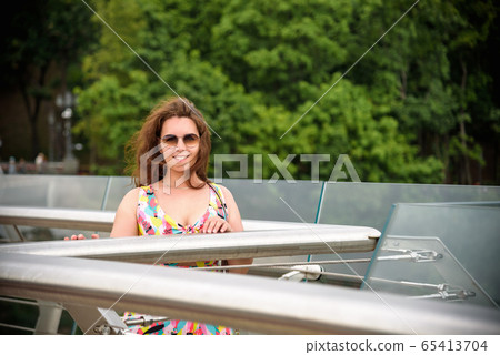 Outdoor lifestyle portrait of amazing glamorous Outdoor lifestyle portrait of amazing glamorous 65413704