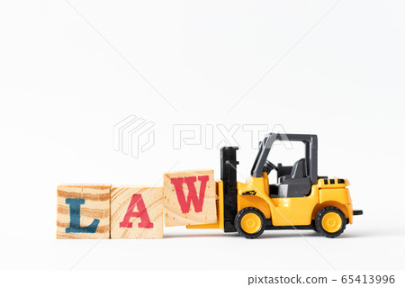 Toy forklift hold wood letter block W to complete  word law on white background 65413996