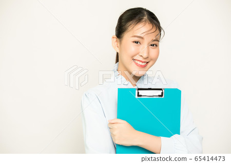 Cute and pretty female office worker person with business file material 65414473