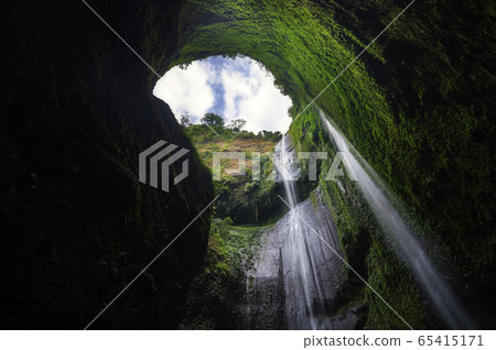 Madakaripura Waterfall is the tallest waterfall in deep Forest in East Java, Indonesia 65415171