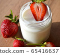 Yogurt with strawberries  on a wooden table. Tasty 65416637