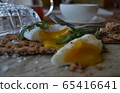 Poached egg on a whole grain bread with arugula 65416641