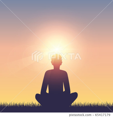meditating person on summer meadow at sunshine 65417179