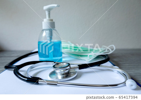 Picture of medical surgical mask and alcohol hand sanitizer, wash dirt to prevent germs 65417394
