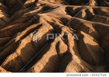 Sci-Fi Mars looking Rocky landscape background at Zabriskie Point, Death Valley NP, California. Sci-Fi Mars looking Rocky landscape background at Zabriskie Point, Death Valley NP, California. 65417526