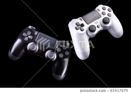 Set of video game joysticks gamepad isolated on a black background Set of video game joysticks gamepad isolated on a black background 65417870