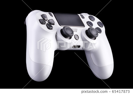 White video game joystick gamepad isolated on a black background White video game joystick gamepad isolated on a black background 65417873
