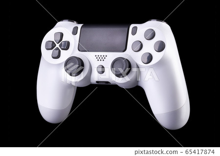 White video game joystick gamepad isolated on a black background White video game joystick gamepad isolated on a black background 65417874