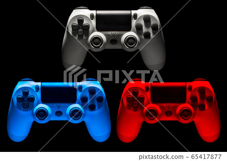 Set of colorful video game joysticks gamepad isolated on a black background Set of colorful video game joysticks gamepad isolated on a black background 65417877