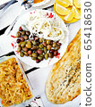 an image of Turkish foods at the buffet. Traditional turkish food on the table. Black olives, lemon, bread, goat cheese 65418630