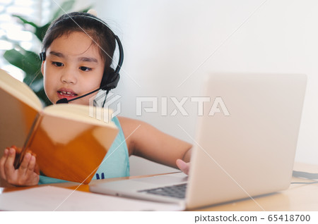 asian girl student wear headphone watch webinar asian girl student wear headphone watch webinar 65418700