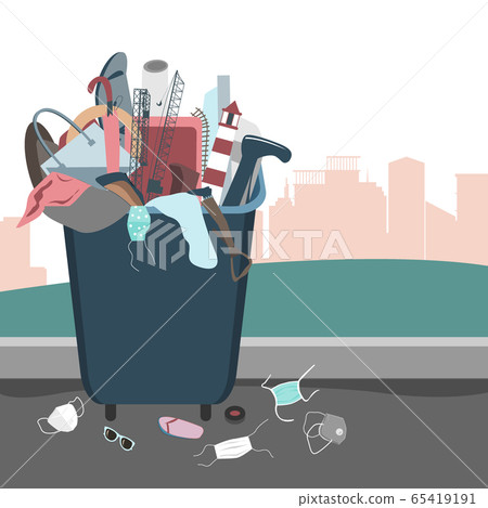 Disposable medical masks thrown on the ground near the garbage container. Environmental pollution problem during coronavirus outbreak 65419191