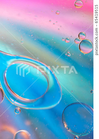 Defocused pastel colored abstract background picture made with oil, water and soap Defocused pastel colored abstract background picture made with oil, water and soap 65419515