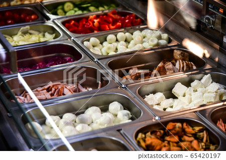 Mix salad on a store shelf 65420197