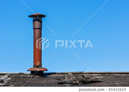 Old rusty chimney. Old rusty chimney. 65421024