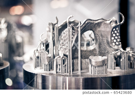 Object printed on metal 3d printer close-up 65423680