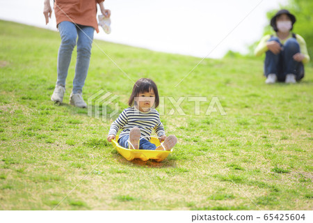 Girls playing in the park 65425604