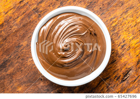 Sweet hazelnut spread. Chocolate cream. Sweet hazelnut spread. Chocolate cream. 65427696