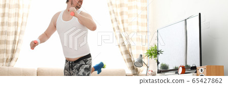 Young handsome man in shorts and 65427862
