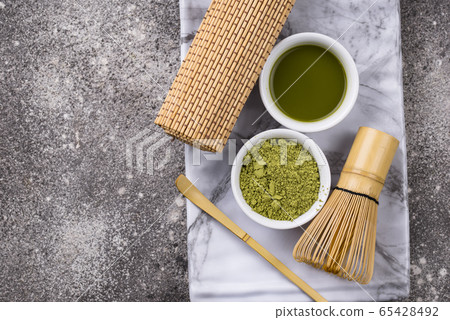 Matcha tea and bamboo whisk 65428492