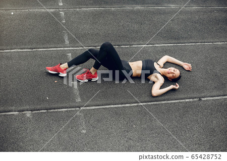Sports girl training at the stadium Sports girl training at the stadium 65428752