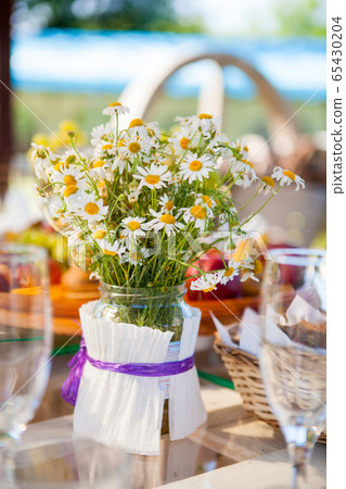 table set dishes and decorated with daisies table set dishes and decorated with daisies 65430204