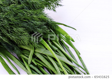 A bunch of fresh chives and dill. Healthy vegetarian food. Close-up. 65431625