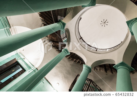 Round stairwell interior of an old apartment house Round stairwell interior of an old apartment house 65432832