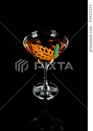 Cocktail Rob Roy . Art in orange- fruits carving. Cocktail Rob Roy . Art in orange- fruits carving. 65433371