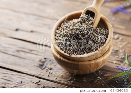 Lavender flowers in a wooden bowl Lavender flowers in a wooden bowl 65434083
