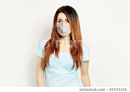 Pretty woman in protective mask on white 65435226