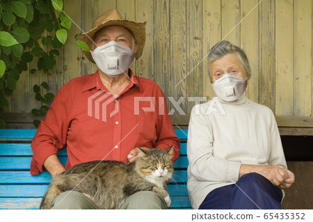 Older couple in protective mask outdoors Older couple in protective mask outdoors 65435352