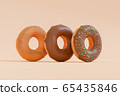 3D Render - Donuts stacked in different styles viewed at an oblique angle. Deep fried doughnuts without topping. Chocolate donuts with icing sprinkle on top. Donuts making process. 65435846