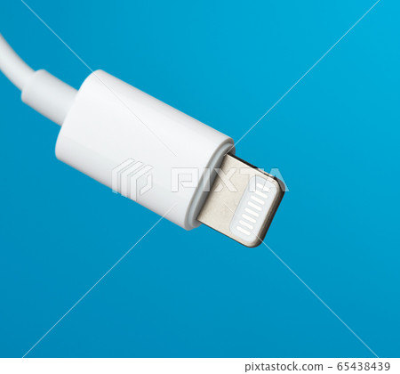White lightning cable on a blue background White lightning cable on a blue background 65438439