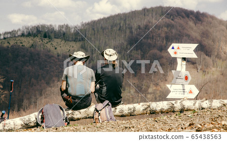 two men trekking in mountain scenery in summer two men trekking in mountain scenery in summer 65438563