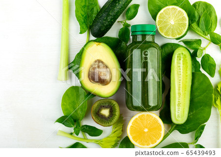 Beautifully laid out fresh green vegetables and a 65439493